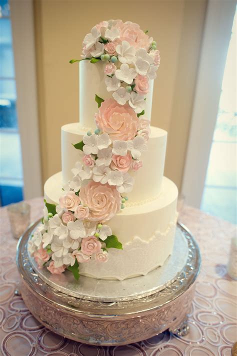 cascading flowers on wedding cake.